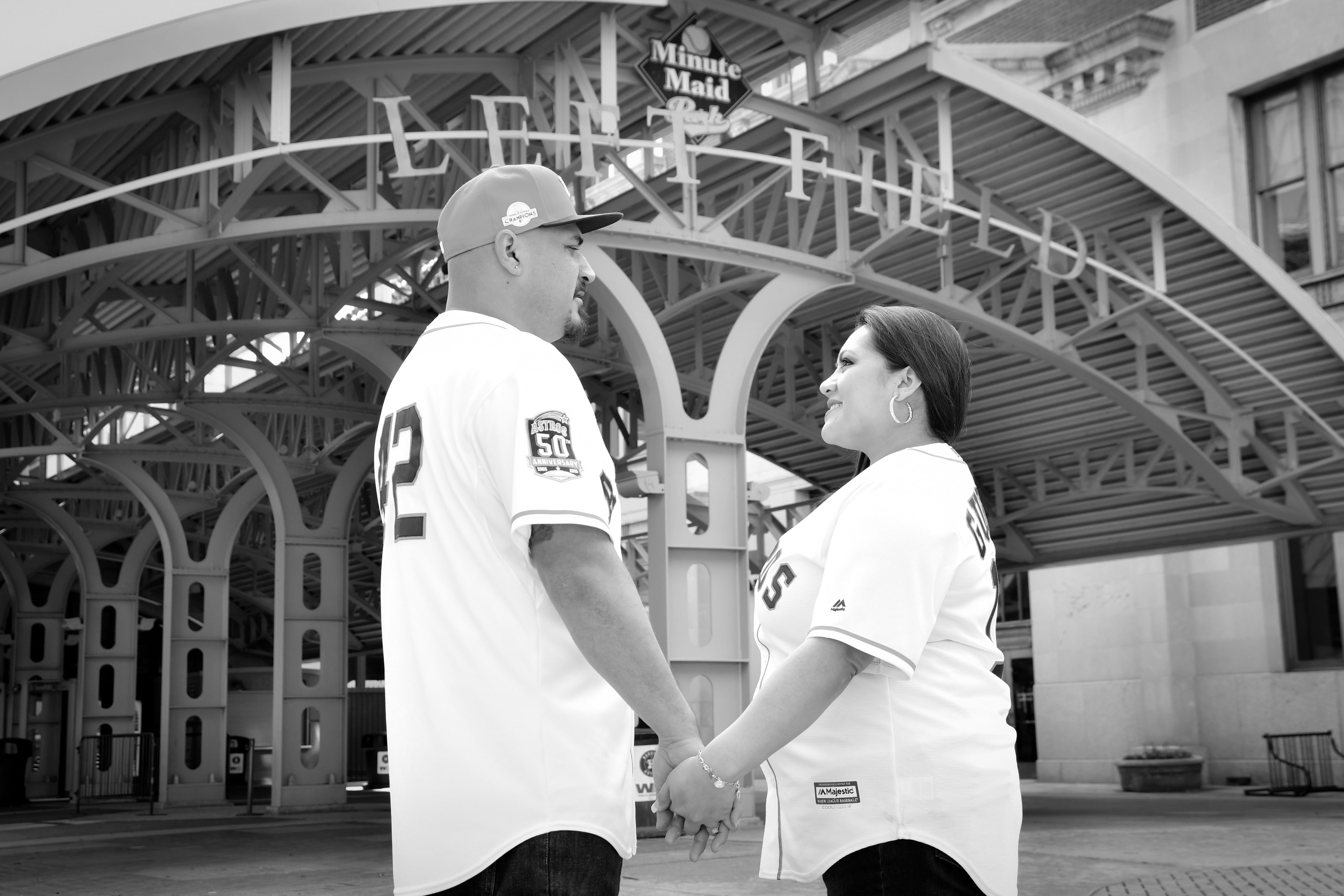 Engagement couple walking hand in hand outdoors