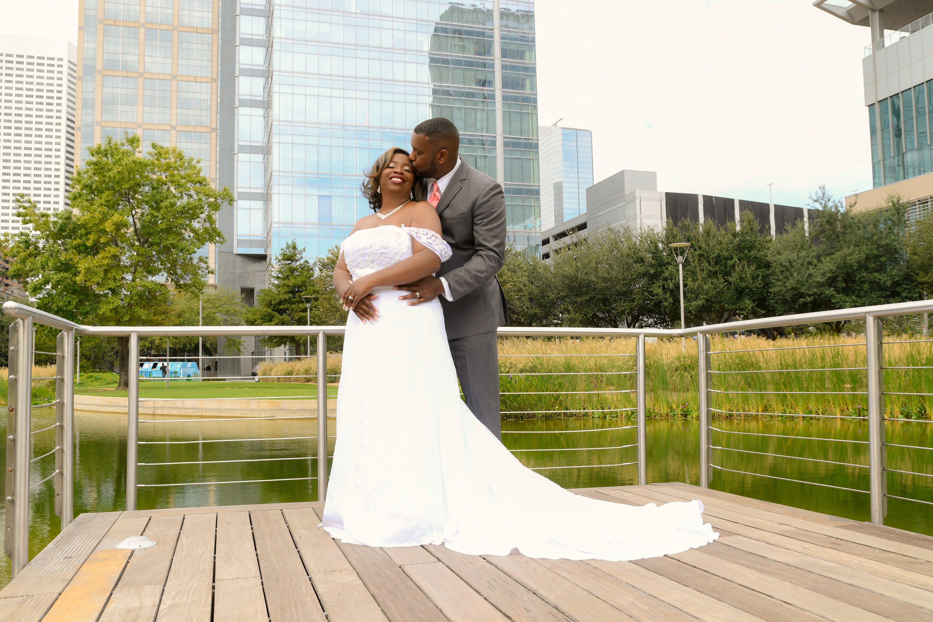 Bride and groom walking outdoor garden venue